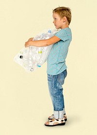 Ecology little boy holding bag of plastic bottle for recycle