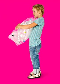 Ecology little boy holding bag of plastic bottle for recycle