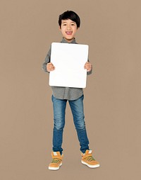Boy holding a blank placard