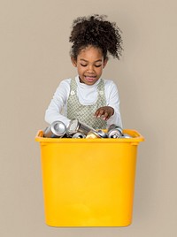 Little Girl Separating Recyclable Metal Can Studio Portrait