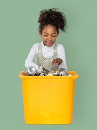 Little Girl Separating Recyclable Metal Can Studio Portrait