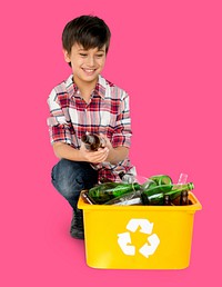 Young Boy Separating Recyclable Glass Bottles