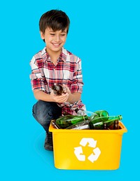 Young Boy Separating Recyclable Glass Bottles
