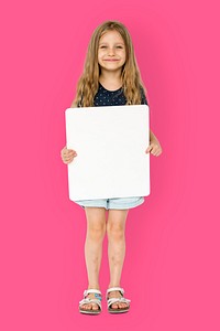 Little girl smiling and holding blank placard