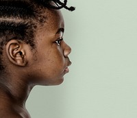 African little girl bare chest studio portrait in side view