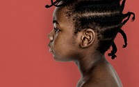 African little girl bare chest studio portrait in side view