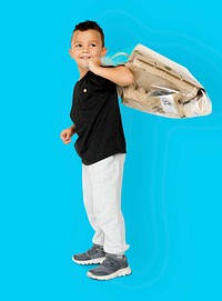 Little Boy Holding Separate Papers Studio Portrait