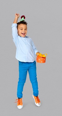 Little Boy with Gift Party Hat Studio Portrait