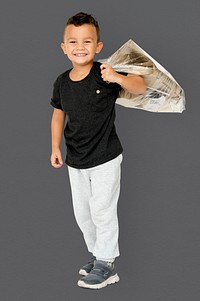 Little Boy Holding Separate Papers Studio Portrait