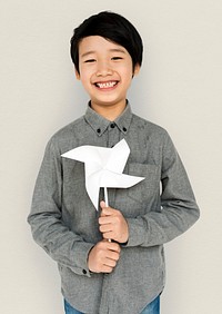 Little Boy Hands Holding Paper Wind Mill Studio Portrait