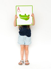 Happiness school kid smiling and holding alphabet animal placard