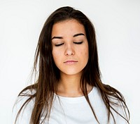 Young adult girl close eyes casual studio portrait