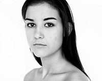 Young Adult Woman Topless with Serene Face Expression Studio Portrait
