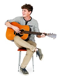 Young Adult Man Sitting Playing Guitar Studio Portrait