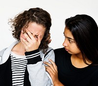 Girl supporting crying friend