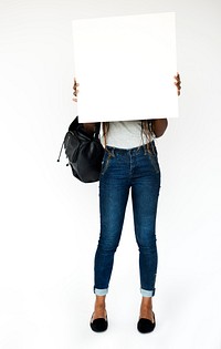 African girl holding blank banner cover face studio portrait