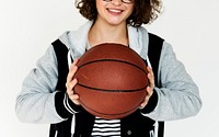 Sport girl holding basket ball and smiling