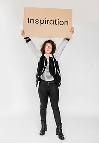 Woman holding and showing the inspiration board