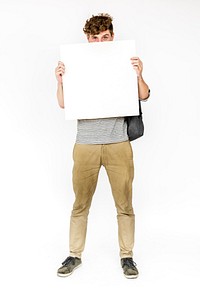 Young Man Face Covered with Blank Paper Board