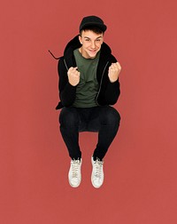 Caucasian young boy jumping active smiling