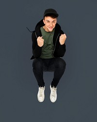 Caucasian young boy jumping active smiling
