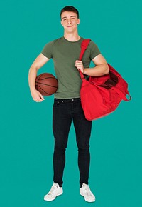 Young adult muscular man holding basketball