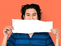 Young adult asian man holding blank paper cover his mouth