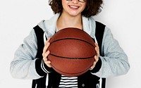 Teenage girl holding a basketball