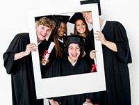 Diverse Students wearing Cap and Gown Holding Photo Frame Studio Portrait