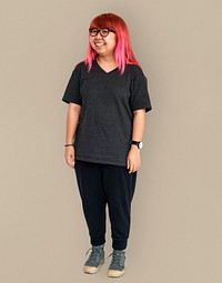 Young adult asian girl standing and smiling studio portrait