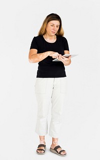 Caucasian woman full body standing and using digital tablet