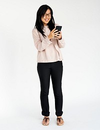 Asian girl smiling browsing phone studio portrait