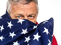 Man holding flag and photoshooting in studio