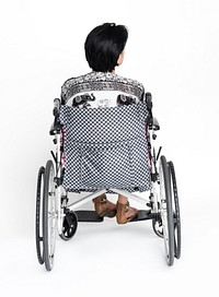 Woman sitting on wheelchair for photoshoot