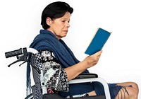 Disable Adult Woman Reading Book on Wheelchair Studio Portrait