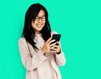 Young adult asian girl smiling and using mobile phone