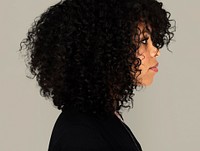 African girl casual studio portrait in side view