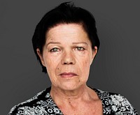 Senior adult woman in moody studio portrait