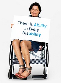 Senior adult woman on wheelchair holding motivation banner