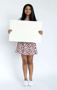 Woman standing doing photoshoot in studio