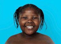 Little african girl smiling shirtless studio portrait