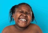 Little african girl smiling shirtless studio portrait