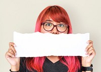 Young adult asian girl holding balnk paper cover her mouth