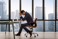 Stressed young businessman overworking