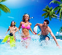 People Playing at a Tropical Beach Enjoyment Concept