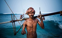 Smiling stilt fisherman in Sri Lanka