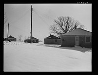 Bantam, Connecticut. War workers' homes. The war has brought approximately a thirty-three percent increase in housing facilities in Bantam--an eighty-unit federally financed housing project about five minutes from the Warren McArthur factory. The first forty units--two to a house, were occupied in early January 4, 1942 and the second forty had already been rented pending completion. As the automobiles and tires of workers in Bantam's defense industries wear out, it is probable that additional new housing facilities will be needed. Sourced from the Library of Congress.