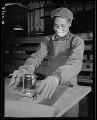 Conversion. Auto body plant. He used to be an automobile worker, but he's one of Uncle Sam's war workers these days, with the conversion of his company to the production of airplane parts. In the picture above, he's polishing a wing segment. Briggs Manufacturing Company, Detroit, Michigan. Sourced from the Library of Congress.