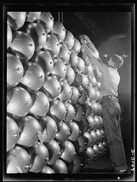 Conversion. Beverage containers to aviation oxygen cylinders. An oxygen cylinder for high altitude flying, manufactured by the metal division of a large Eastern rubber factory is completed, and after having passed all tests, it is placed on the huge stack ready for shipment to the U.S. Army. Firestone, Akron, Ohio. Sourced from the Library of Congress.