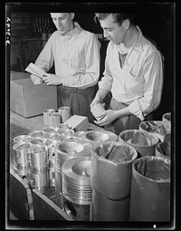 Aluminum casting. Finished pistons are wrapped and packed for shipment to ordnance depots: they're scheduled for use in army jeeps. Aluminum pistons are one product of this giant Midwest factory now converted to war production. Aluminum Industries Inc., Cincinnati, Ohio. Sourced from the Library of Congress.